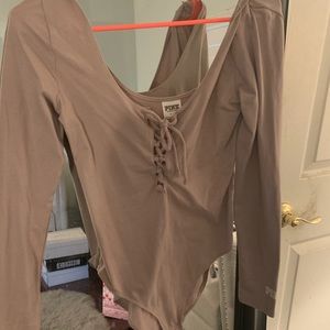 Pink brand beige body suit.